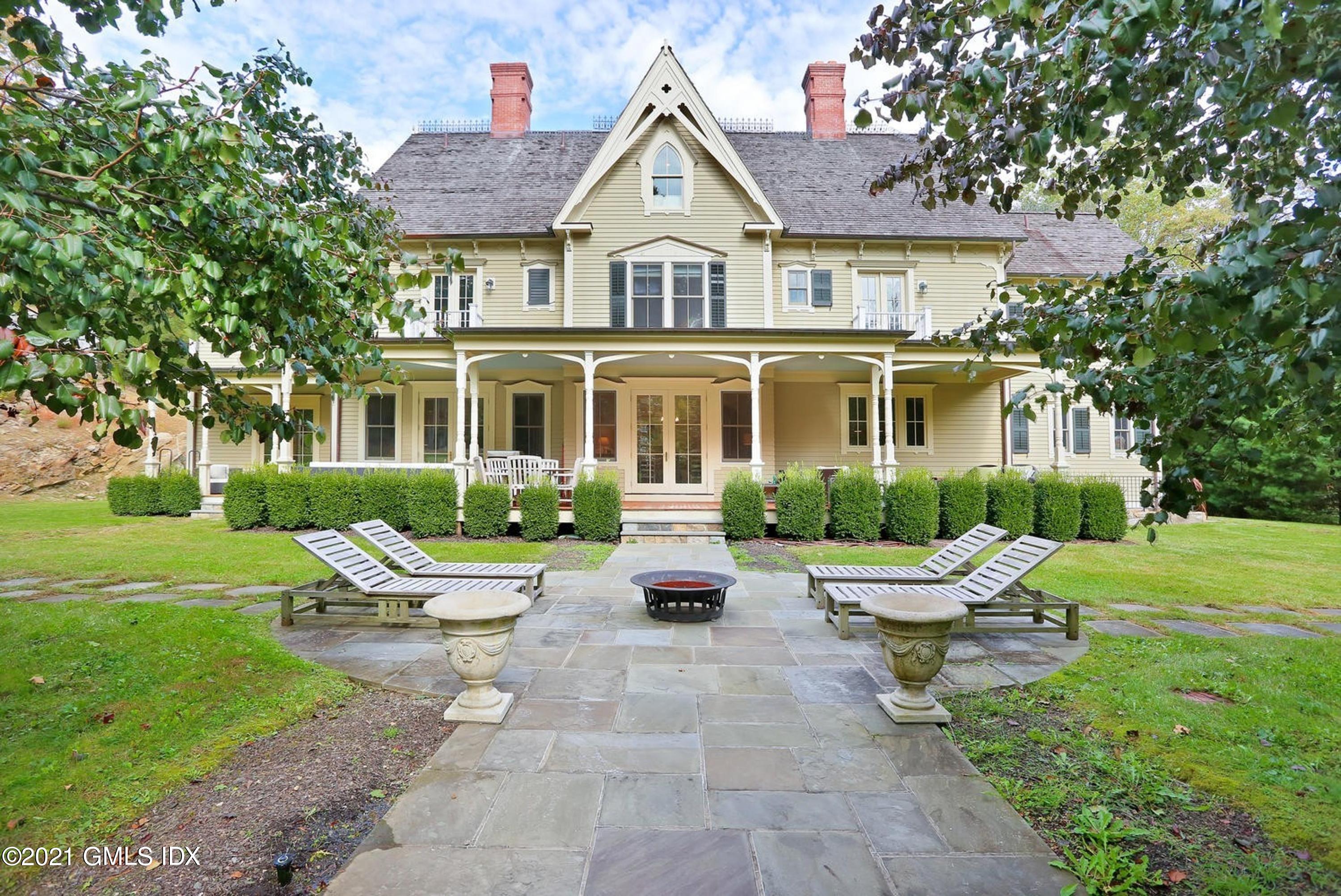 477 Riversville Road Greenwich, CT 06831 - Photo 3 of 33 a house with garden in front of it