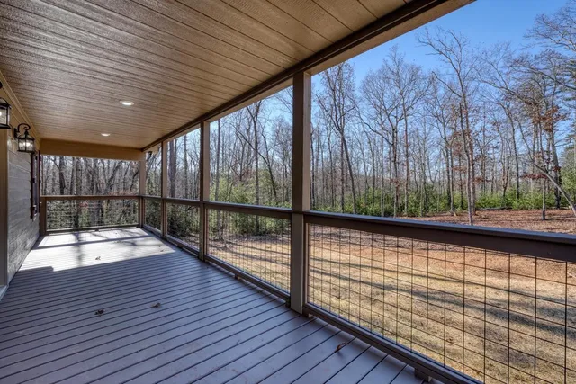 a view of balcony with wooden floor