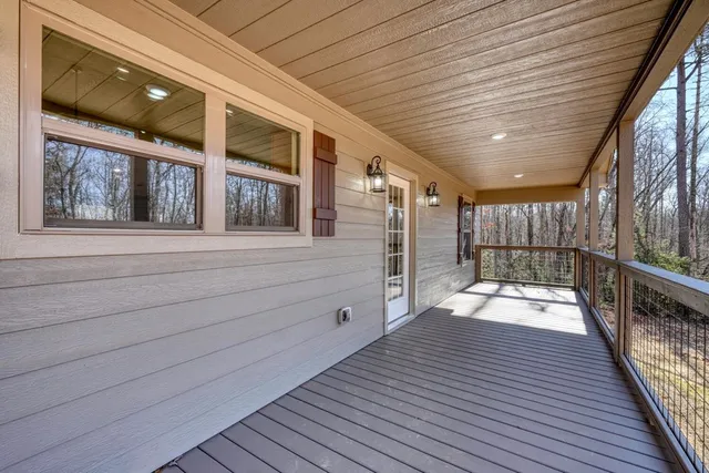 a view of a balcony with wooden floor