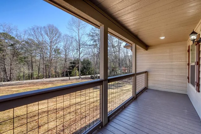 a view of two chairs in a balcony