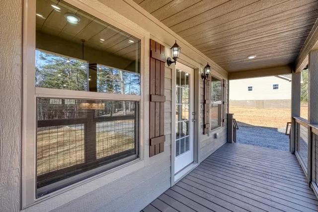 a view of a balcony with wooden floor