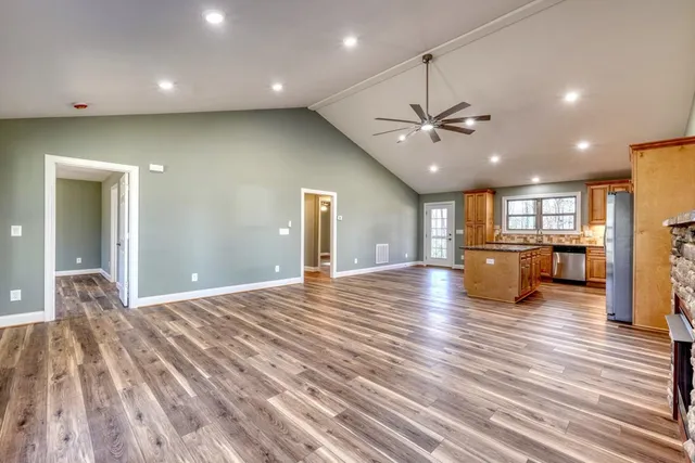 a view of a kitchen with a sink and a ceiling fan