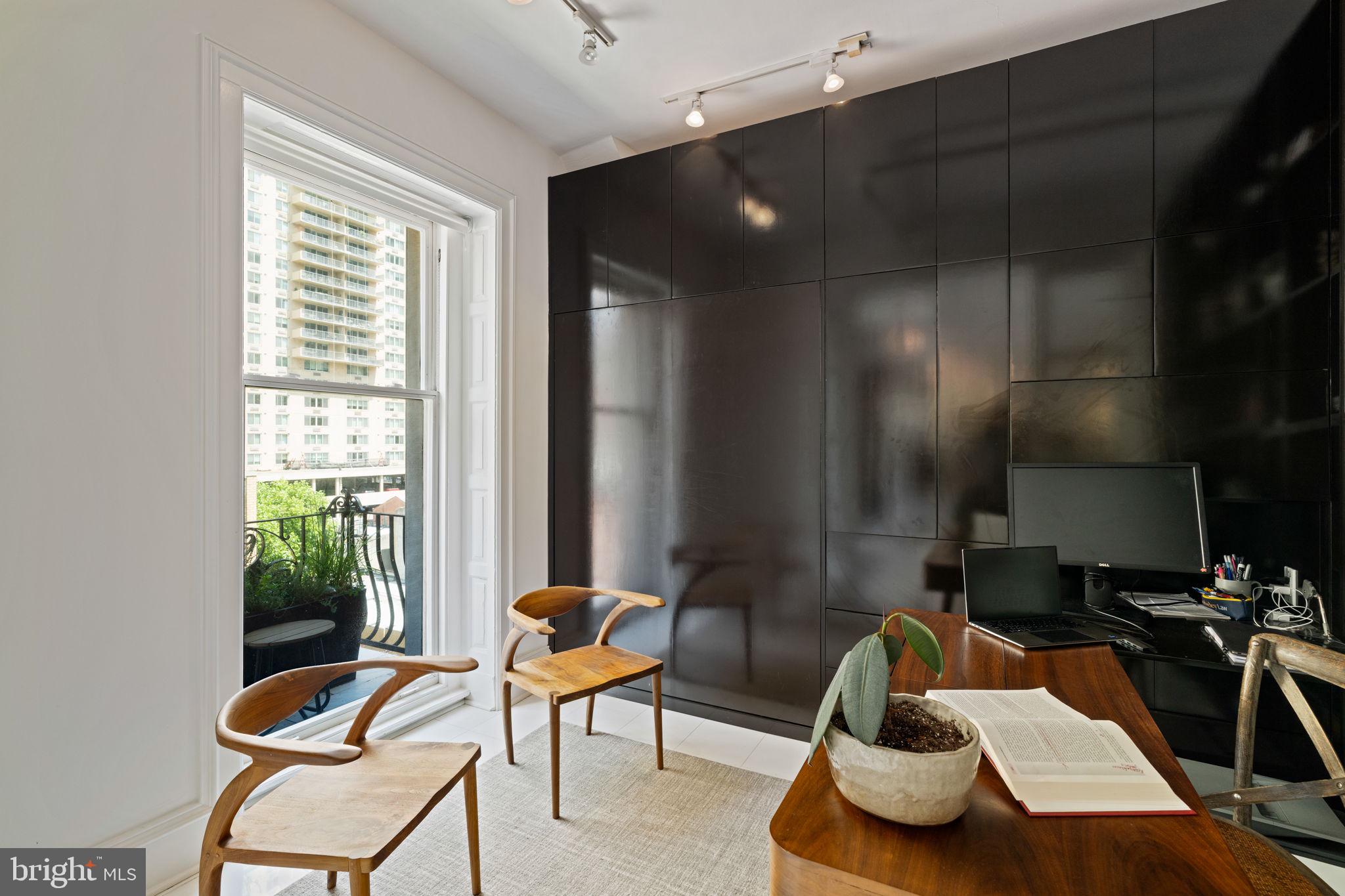 1920 Chestnut Street, Unit 5N Philadelphia, PA 19103 - Photo 19 of 33 a room with furniture and a window
