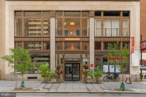 a front view of a building with glass windows