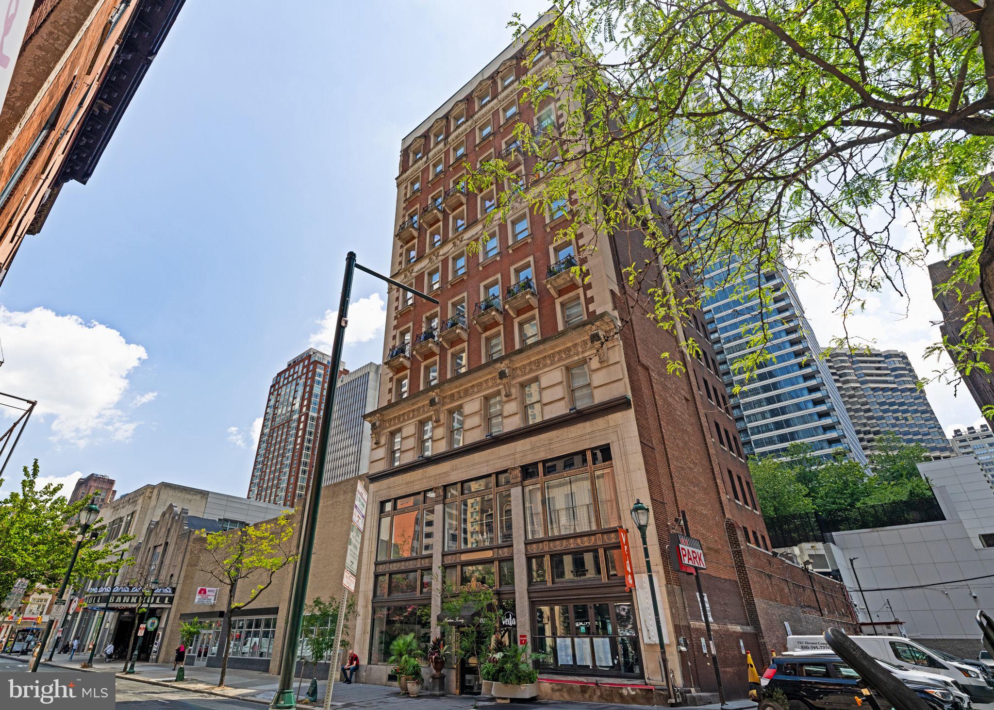 1920 Chestnut Street, Unit 5N Philadelphia, PA 19103 - Photo 32 of 33 a front view of a multi story residential apartment building with yard and staircase