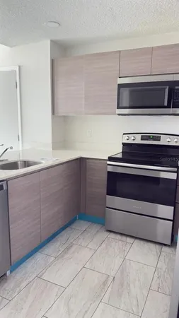 a kitchen with appliances and cabinets