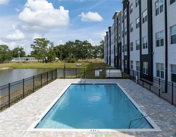 a view of a swimming pool with a lake