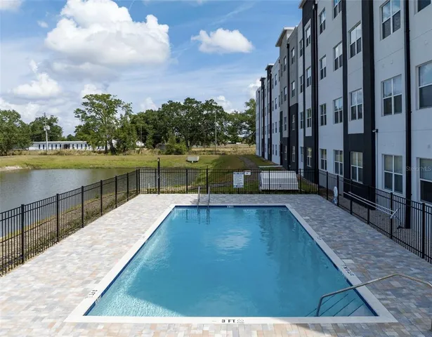 a view of a swimming pool with a lake