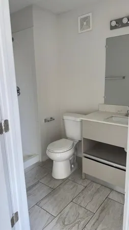 a bathroom with a toilet and a sink