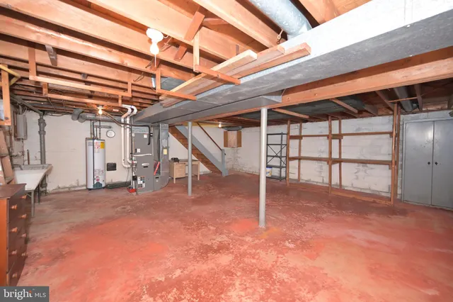 a view of an empty room with a white walls