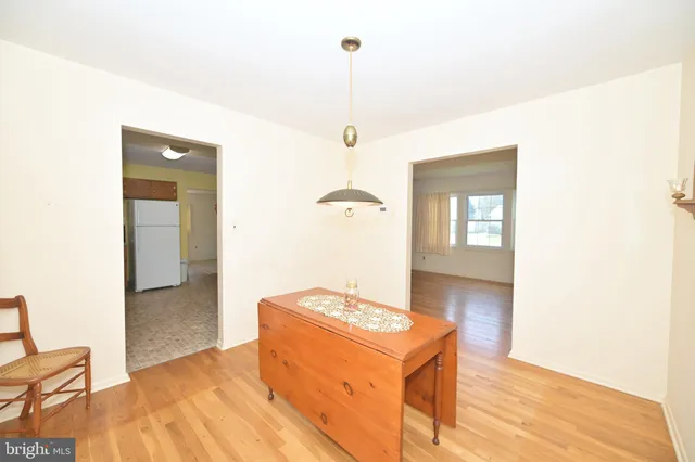 a bedroom with a bed and a table