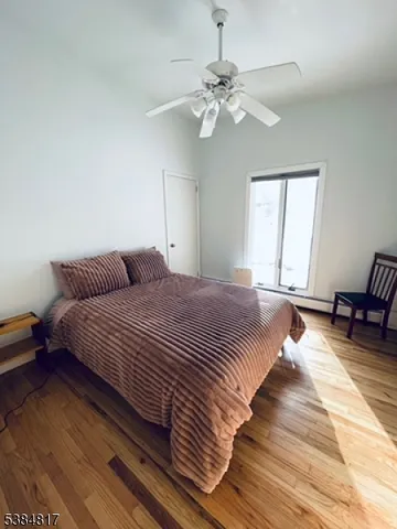 a bedroom with bed and window