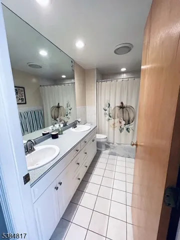 a bathroom with a sink a mirror and a shower