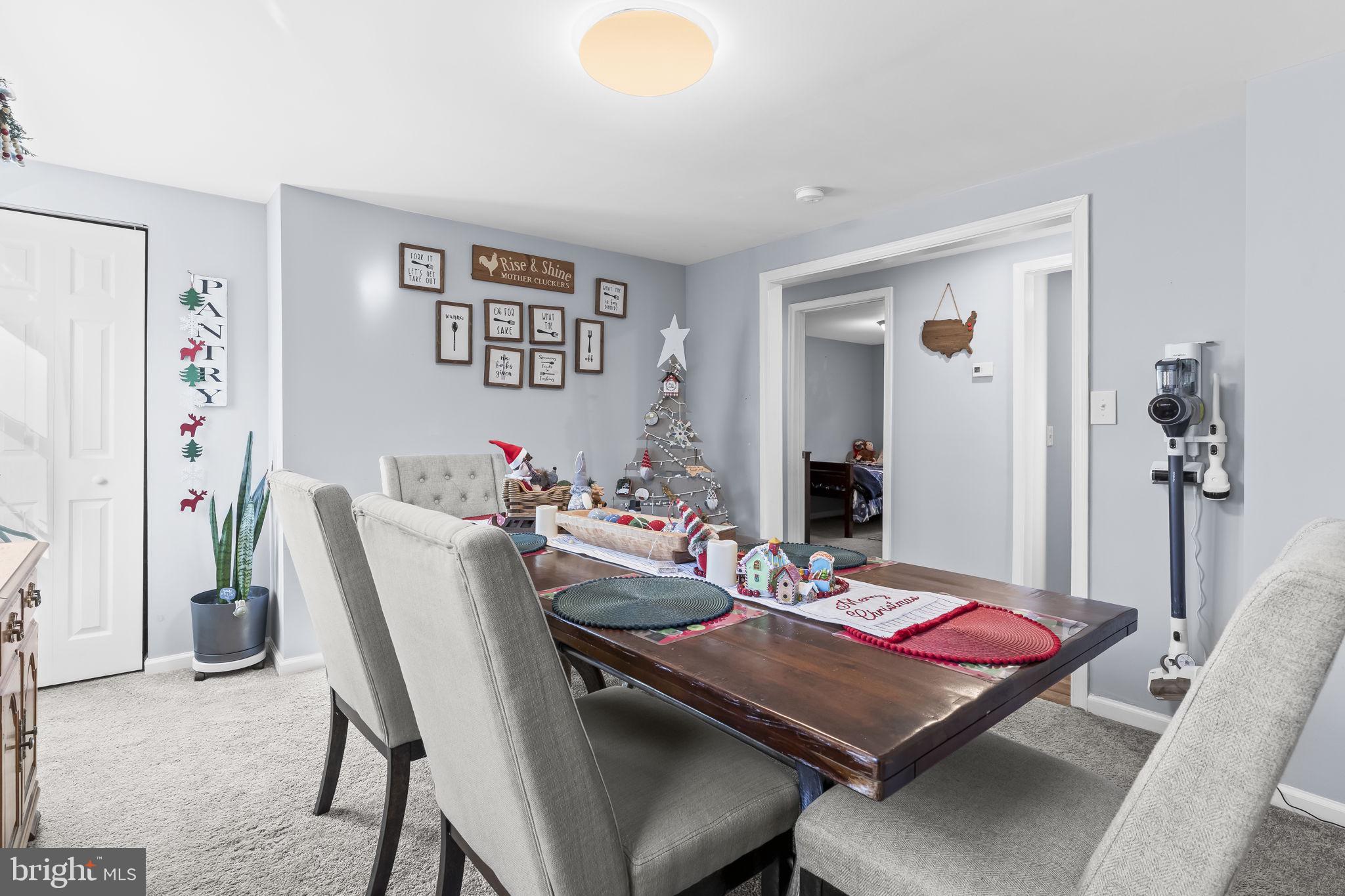 490 Clay Hammond Road Prince Frederick, MD 20678 - Photo 12 of 48 a view of a dining room with furniture and a table