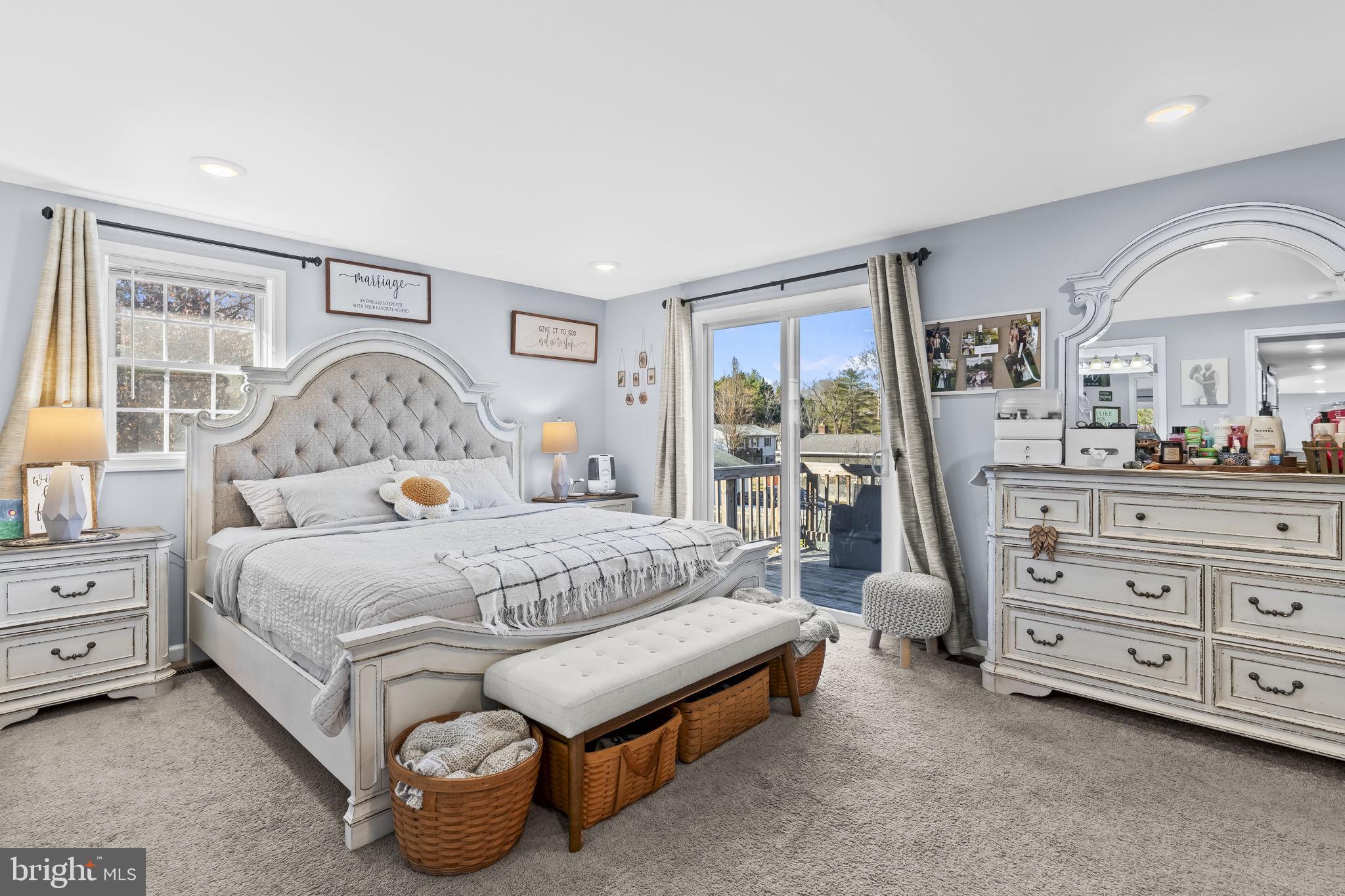 490 Clay Hammond Road Prince Frederick, MD 20678 - Photo 13 of 48 a bedroom with a bed and a dresser