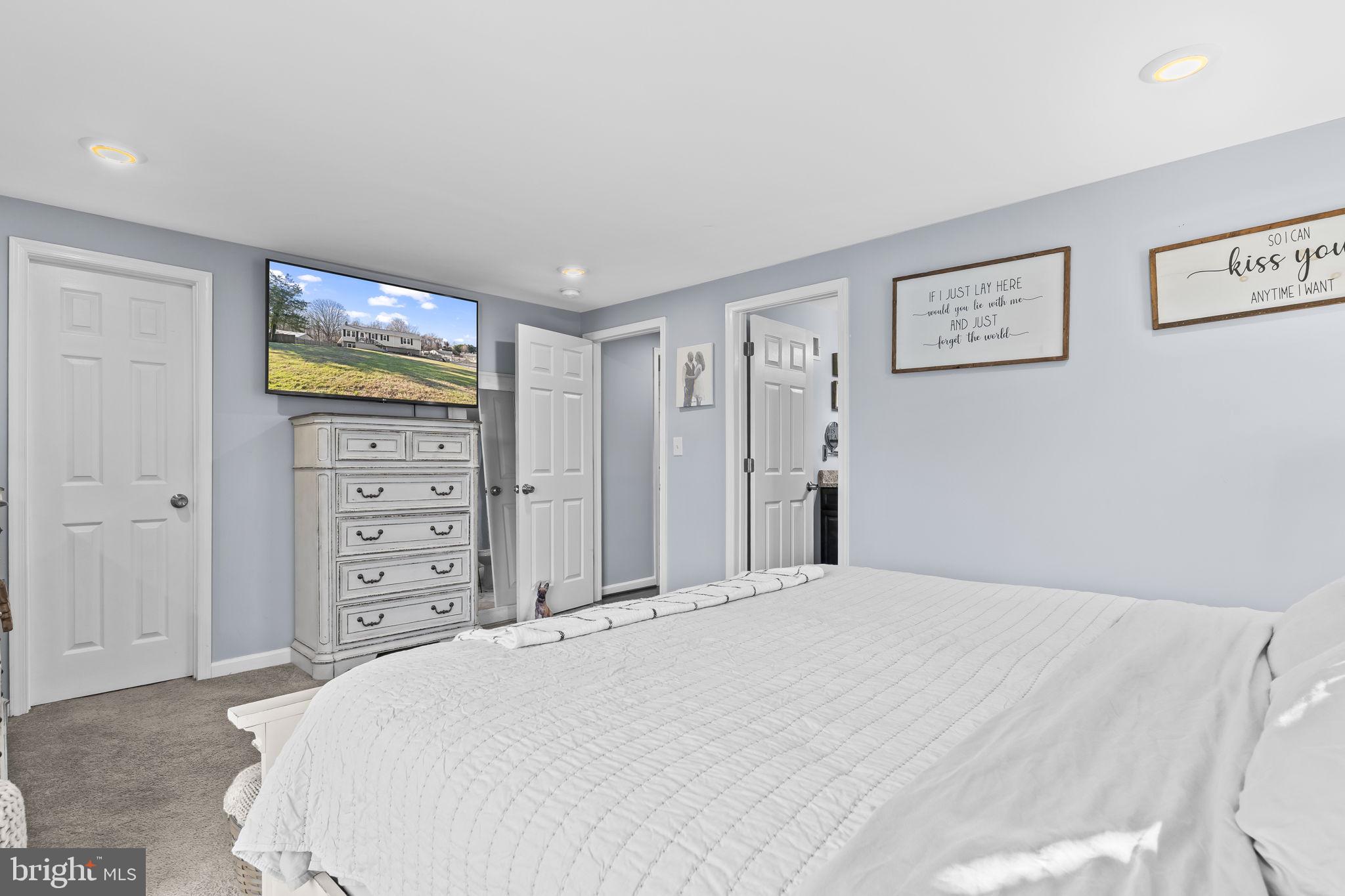 490 Clay Hammond Road Prince Frederick, MD 20678 - Photo 17 of 48 a bedroom with a bed and dresser