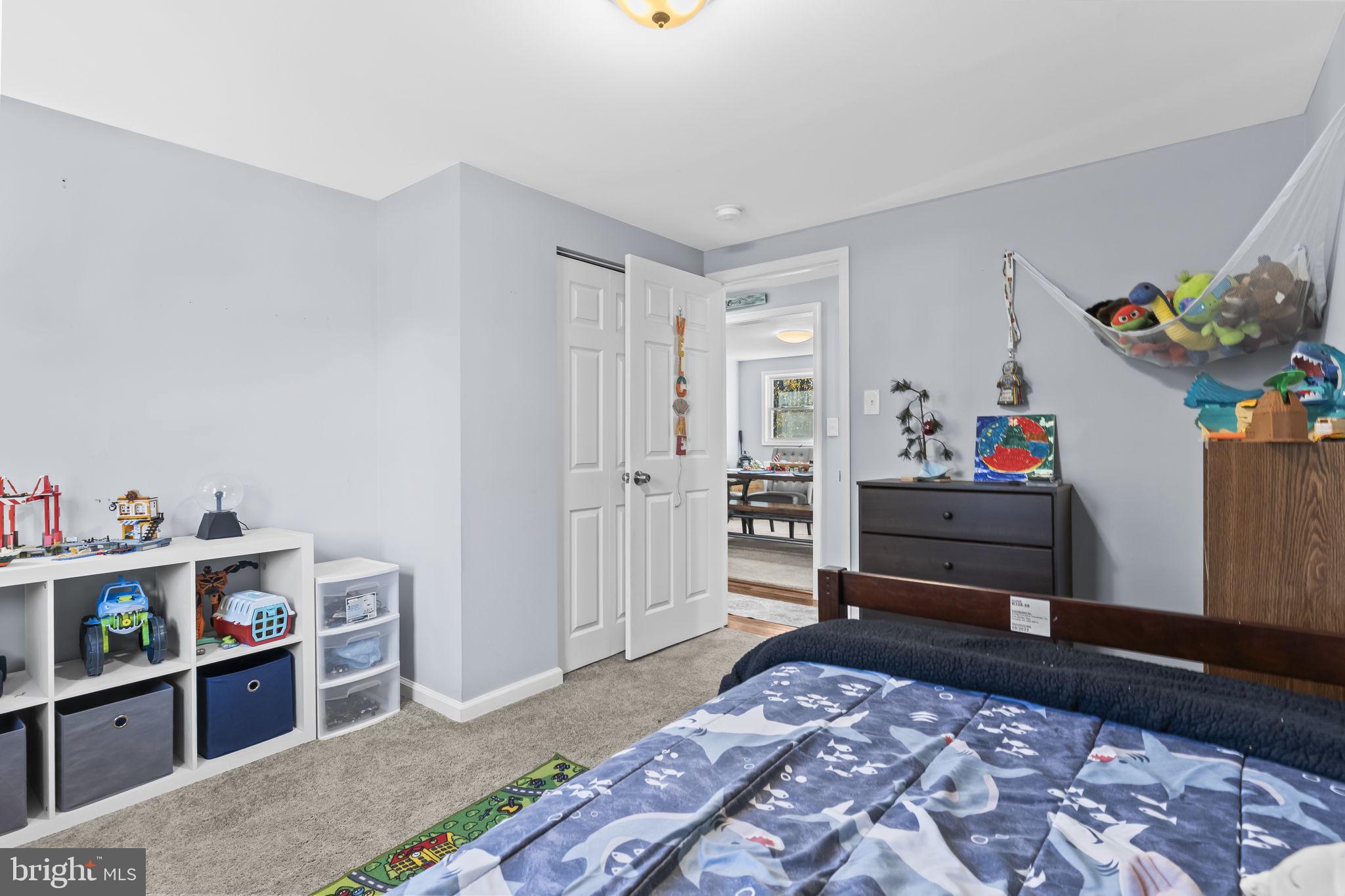 490 Clay Hammond Road Prince Frederick, MD 20678 - Photo 19 of 48 a bedroom with furniture and a window