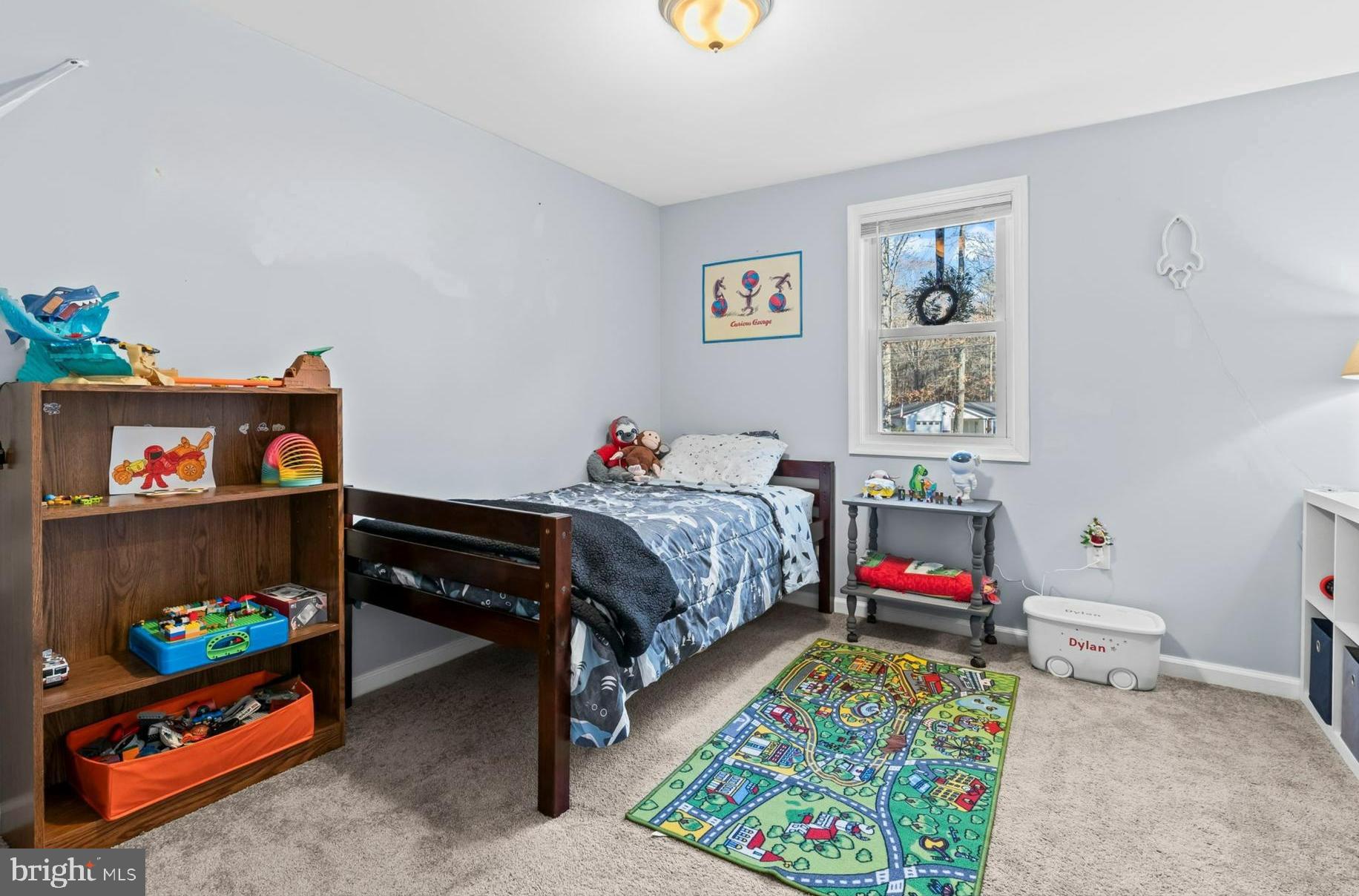 490 Clay Hammond Road Prince Frederick, MD 20678 - Photo 20 of 48 a bedroom with a bed and a baby crib