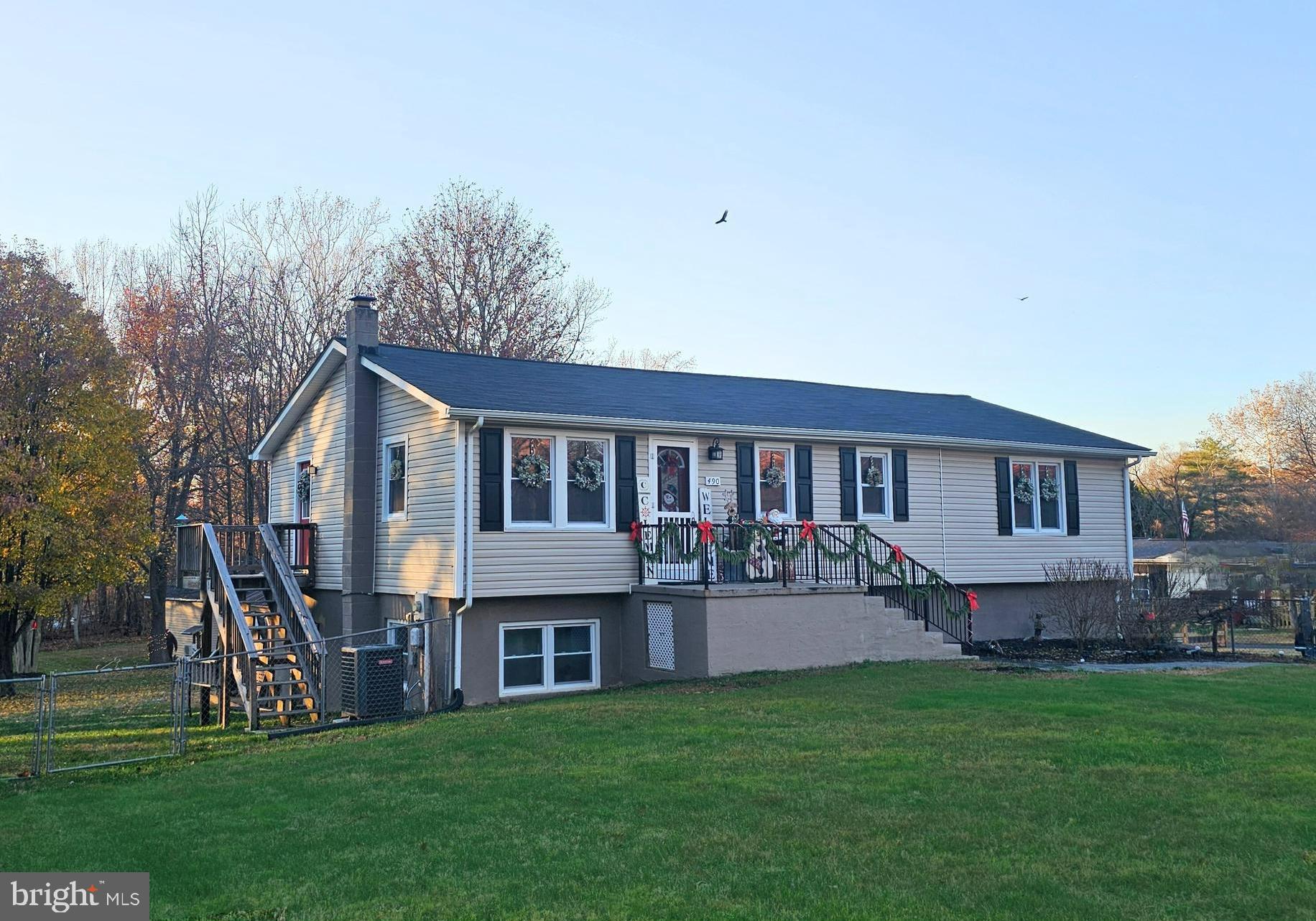 490 Clay Hammond Road Prince Frederick, MD 20678 - Photo 2 of 48 a front view of house with yard and green space