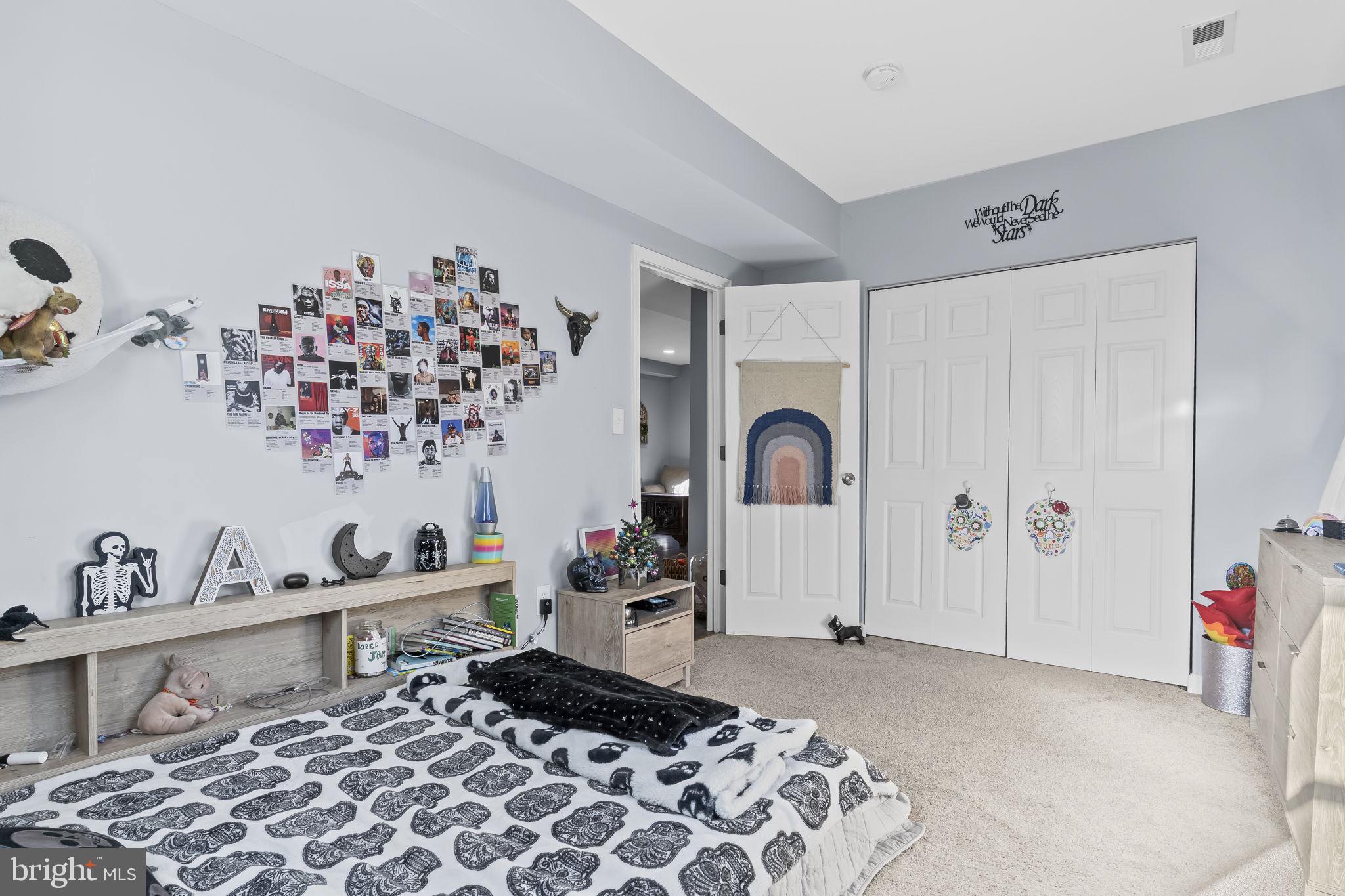 490 Clay Hammond Road Prince Frederick, MD 20678 - Photo 26 of 48 a bedroom with a bed and a dresser