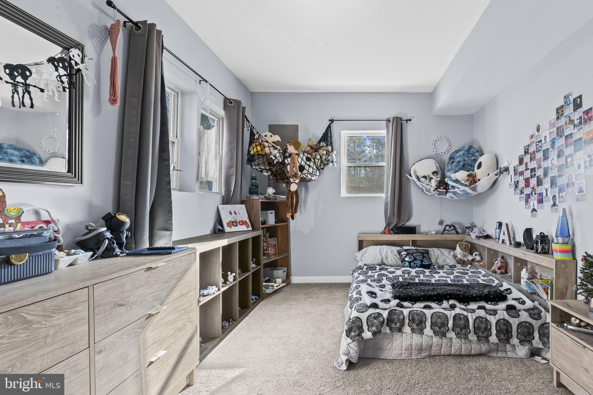 490 Clay Hammond Road Prince Frederick, MD 20678 - Photo 27 of 48 a bedroom with furniture and a large mirror