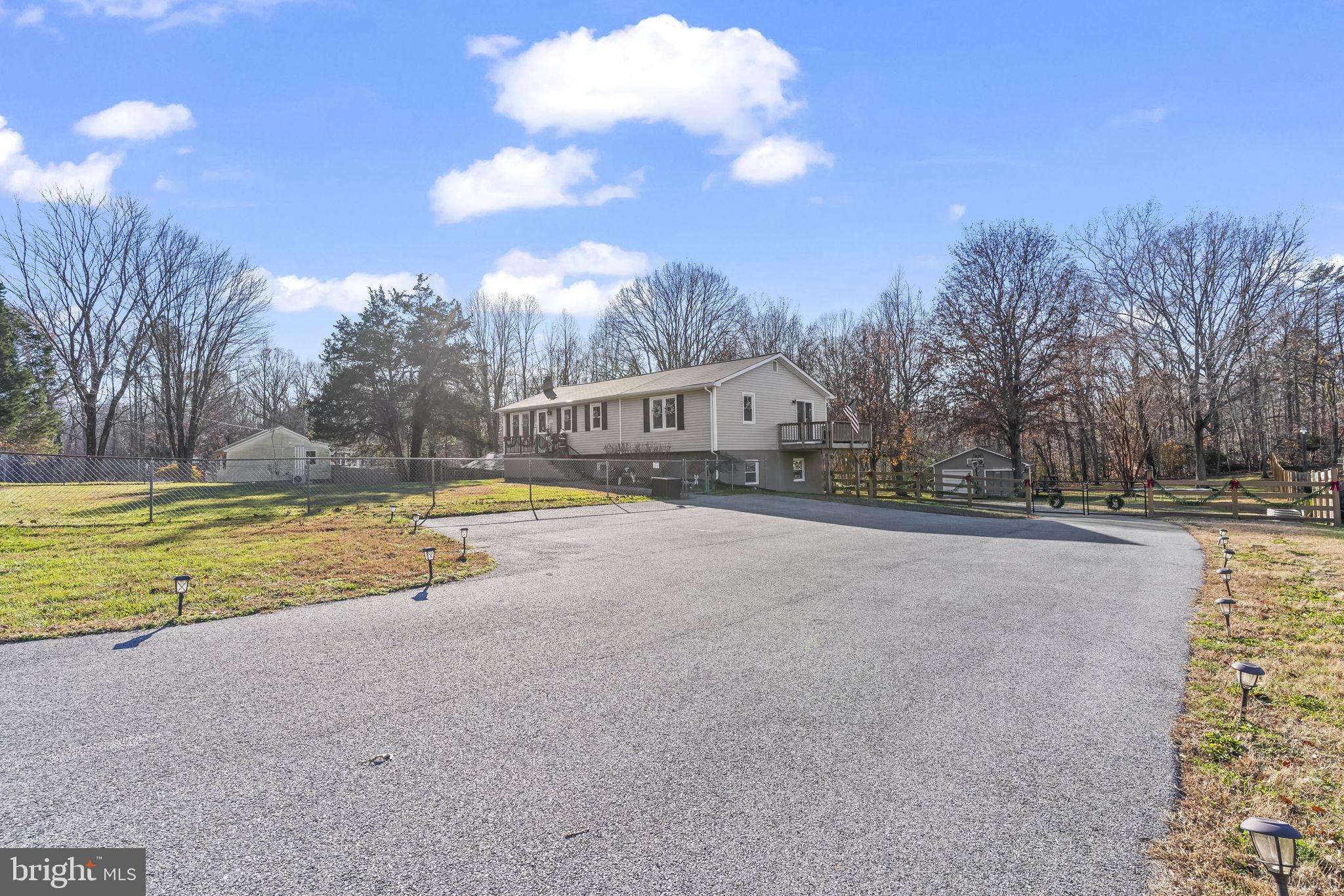490 Clay Hammond Road Prince Frederick, MD 20678 - Photo 34 of 48 a view of swimming pool with outdoor seating and yard in back