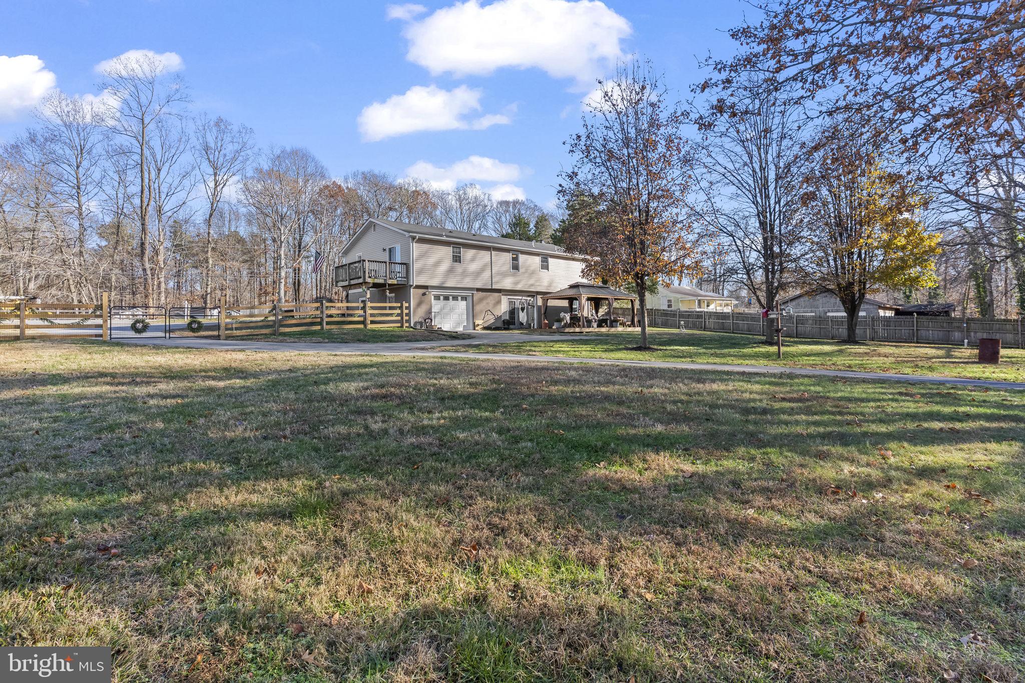 490 Clay Hammond Road Prince Frederick, MD 20678 - Photo 37 of 48 a view of a big yard with a house in the background