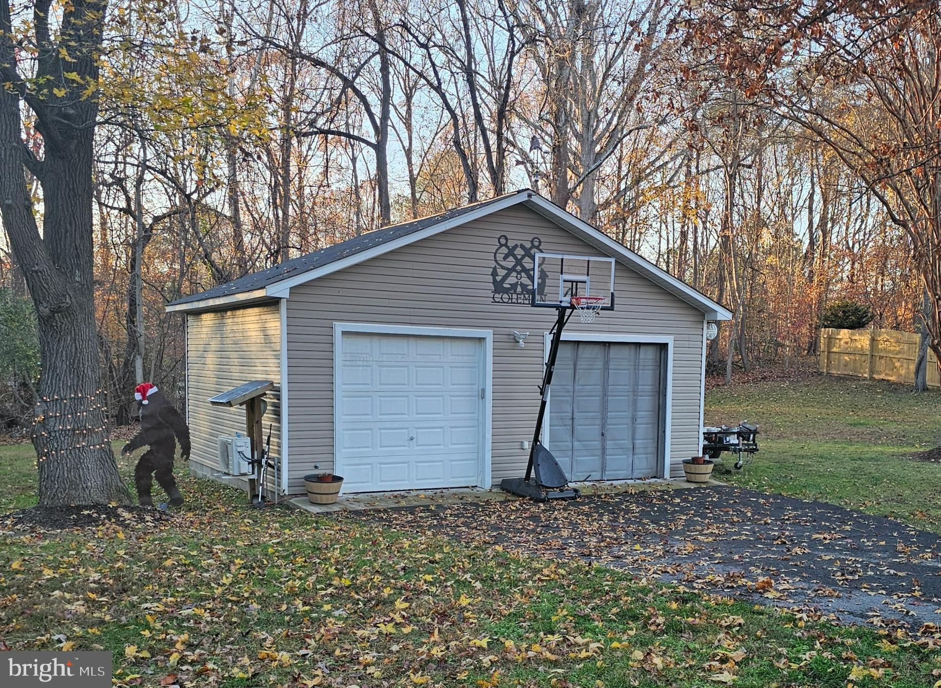 490 Clay Hammond Road Prince Frederick, MD 20678 - Photo 43 of 48 a front view of house with backyard and trees