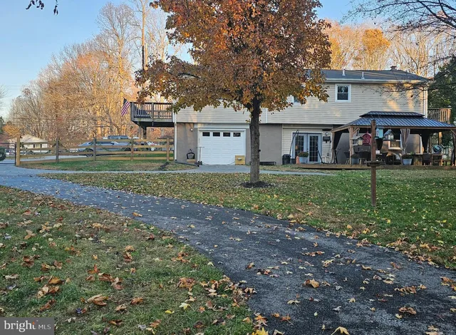 a view of a house with a big yard