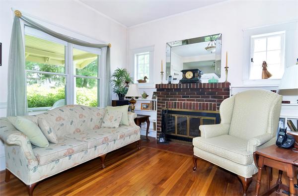 38 Middle Street Lexington, MA 02421 - Photo 5 of 30 a living room with furniture a fireplace and a large window