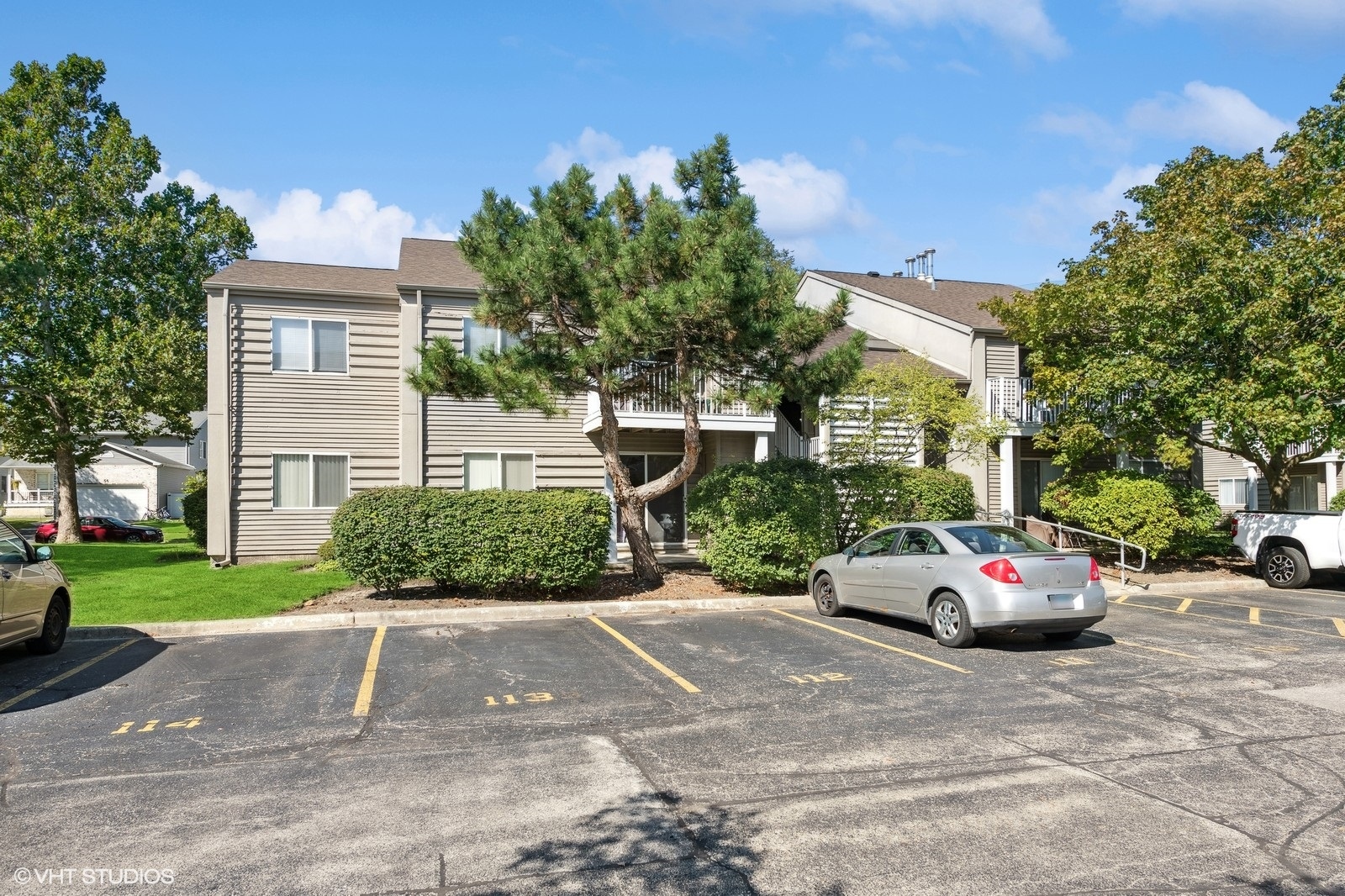 a cars parked in front of a brick house
