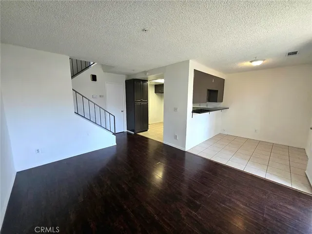 a view of a livingroom with wooden floor