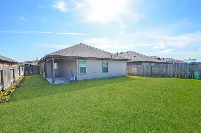 a view of a backyard with garden
