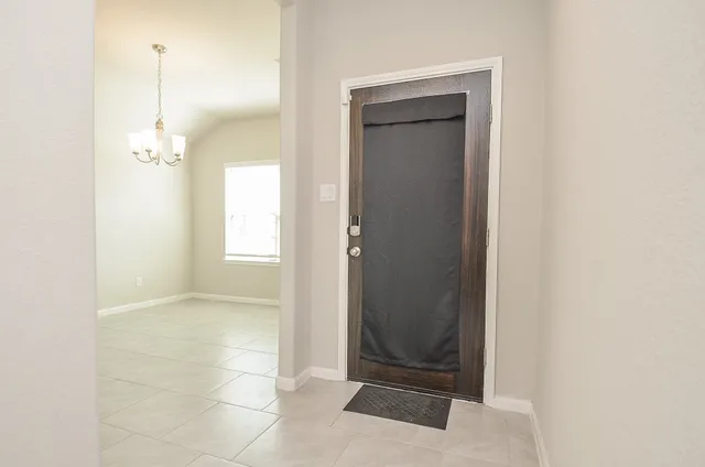 a view of a bathroom with a glass door and a window