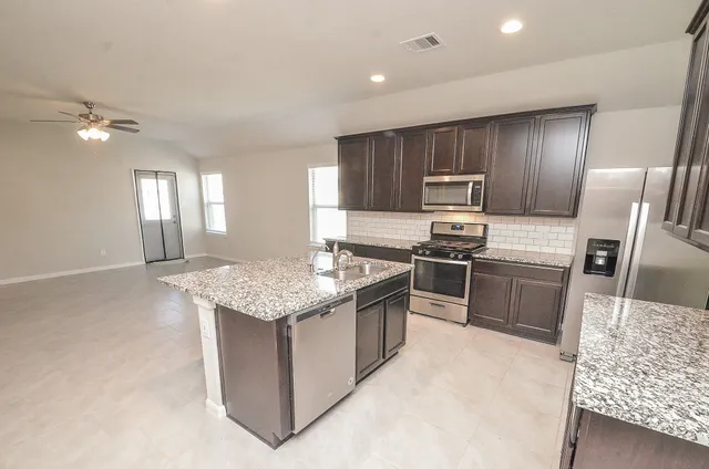 a view of a house with a back yard