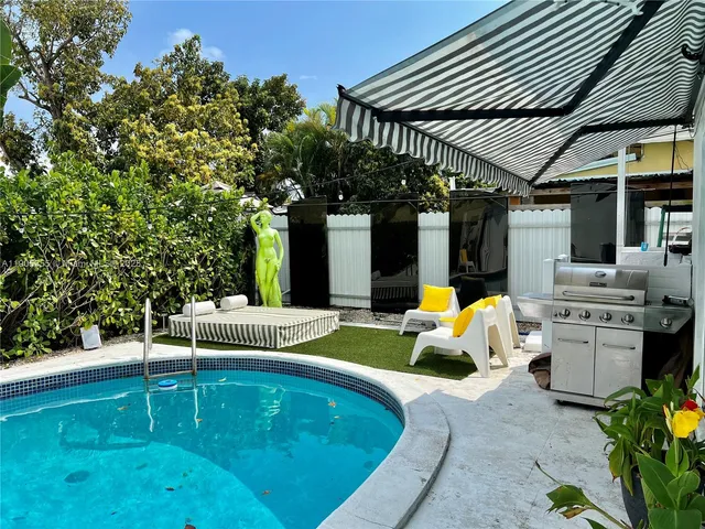 a view of swimming pool with patio