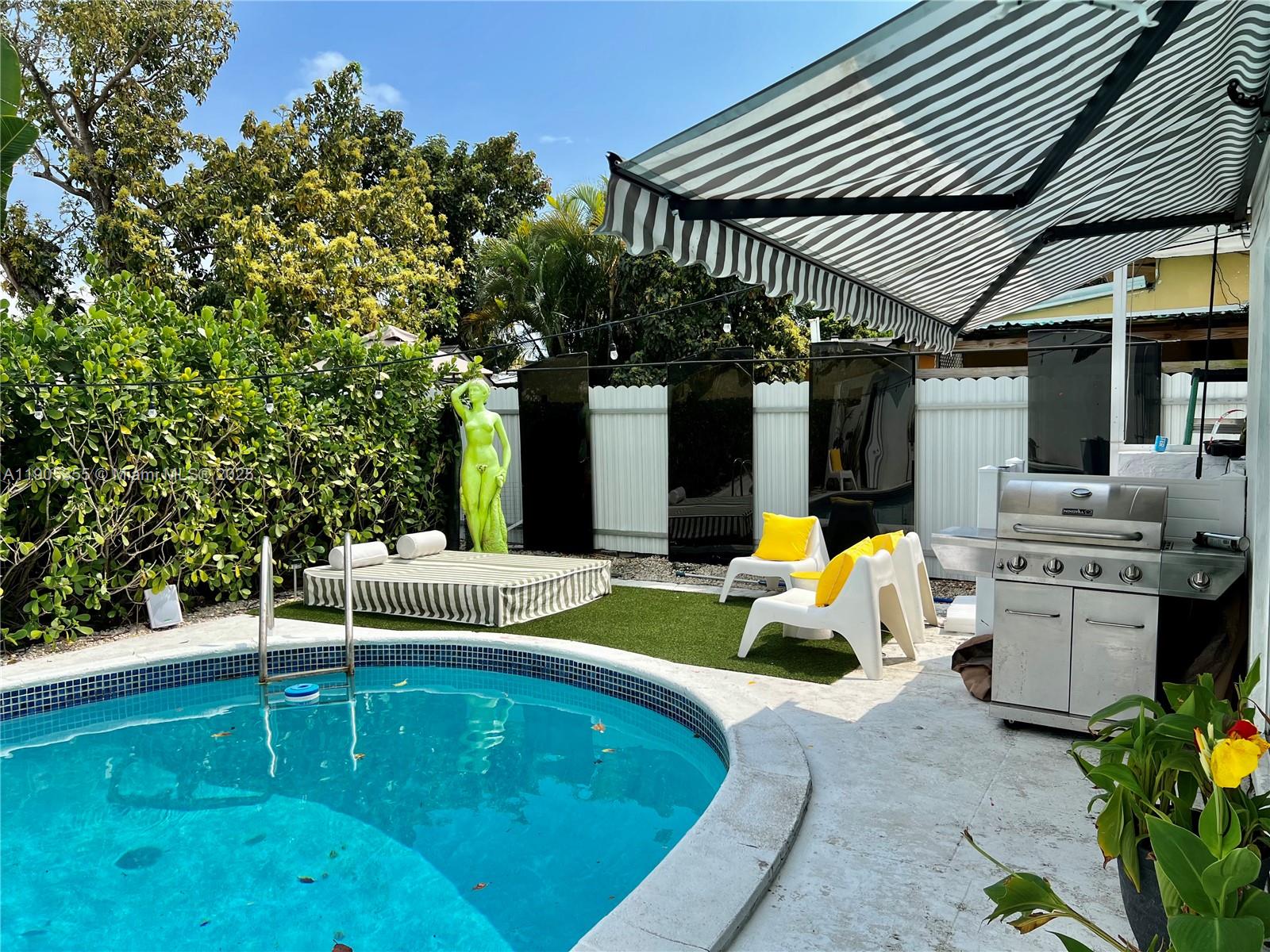 1051 Northwest 25th Avenue Miami, FL 33125 - Photo 3 of 7 a view of swimming pool with patio