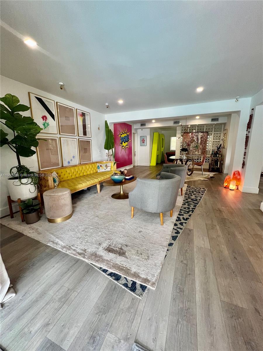 1051 Northwest 25th Avenue Miami, FL 33125 - Photo 4 of 7 a kitchen with stainless steel appliances granite countertop a sink stove and granite countertops