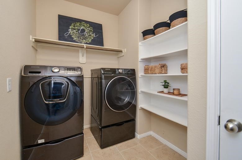 4327 Estes Ridge Lane Katy, TX 77493 - Photo 17 of 37 a utility room with dryer and washer
