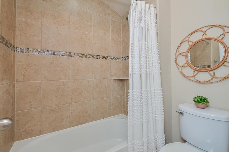 4327 Estes Ridge Lane Katy, TX 77493 - Photo 20 of 37 a bathroom with a bathtub and shower