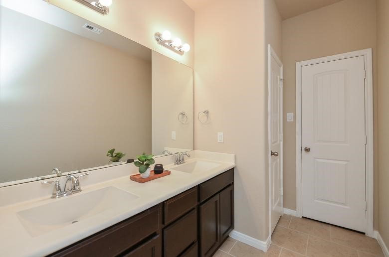 4327 Estes Ridge Lane Katy, TX 77493 - Photo 21 of 37 a bathroom with a sink double vanity and a mirror