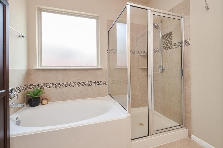 4327 Estes Ridge Lane Katy, TX 77493 - Photo 24 of 37 a white bath tub sitting next to a shower