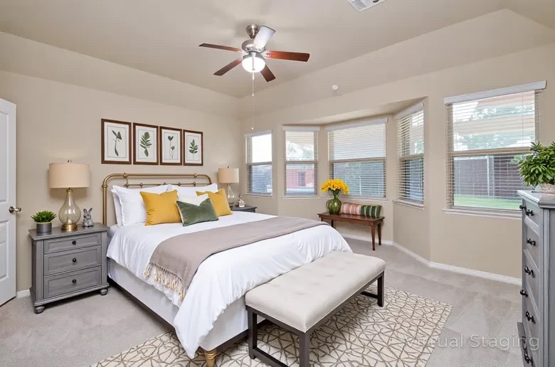 4327 Estes Ridge Lane Katy, TX 77493 - Photo 25 of 37 a bedroom with a large bed and a chandelier