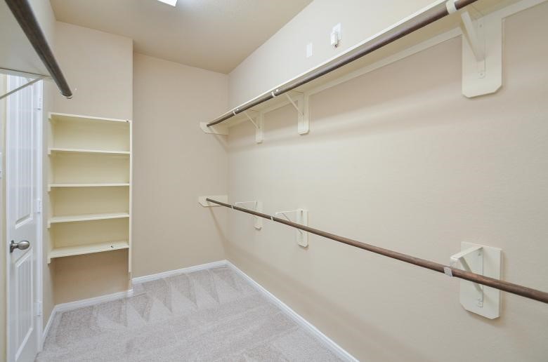 4327 Estes Ridge Lane Katy, TX 77493 - Photo 26 of 37 a view of an empty walk in closet