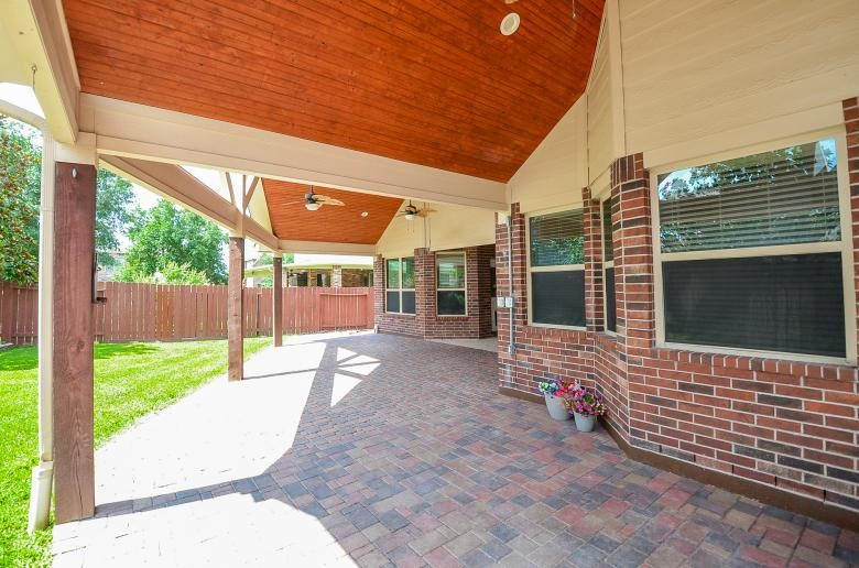 4327 Estes Ridge Lane Katy, TX 77493 - Photo 29 of 37 a view of a backyard with table and chairs and wooden fence