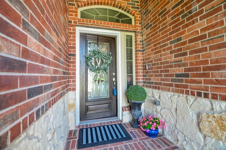 4327 Estes Ridge Lane Katy, TX 77493 - Photo 30 of 37 a view of a brick wall with an outdoor space