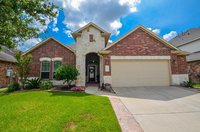 4327 Estes Ridge Lane Katy, TX 77493 - Photo 35 of 37 a front view of a house with swing and plants