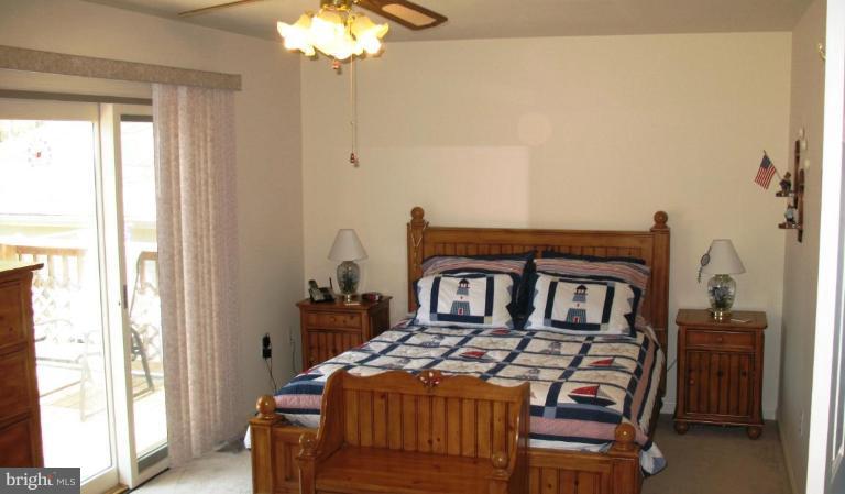3615 Pine Tree Road Port Republic, MD 20676 - Photo 11 of 16 a bedroom with furniture and a window