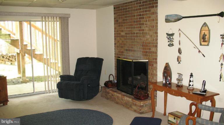 3615 Pine Tree Road Port Republic, MD 20676 - Photo 7 of 16 a living room with furniture and a floor to ceiling window