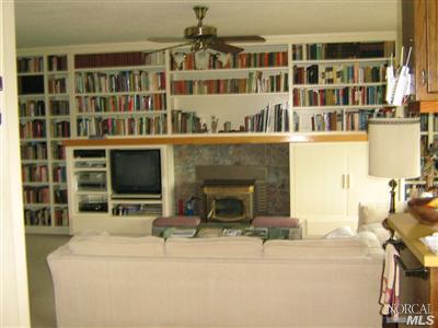 513 Grandview Road Sebastopol, CA 95472 - Photo 3 of 11 a living room with a fireplace and a flat screen tv
